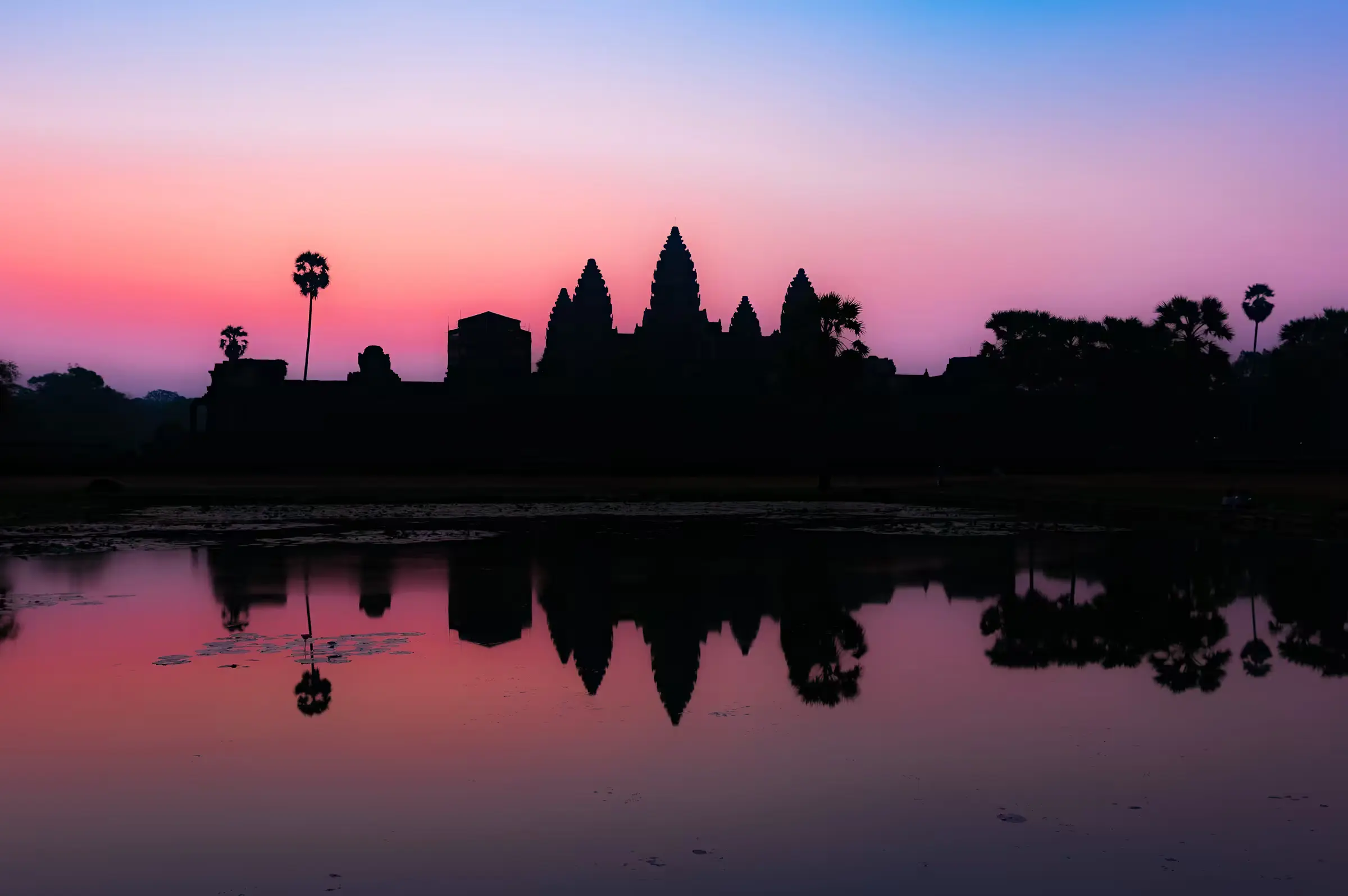 Angkor Wat: Dawn Reflection Angkor Wat and its reflection in the moat at sunrise, Siem Reap, Cambodia.