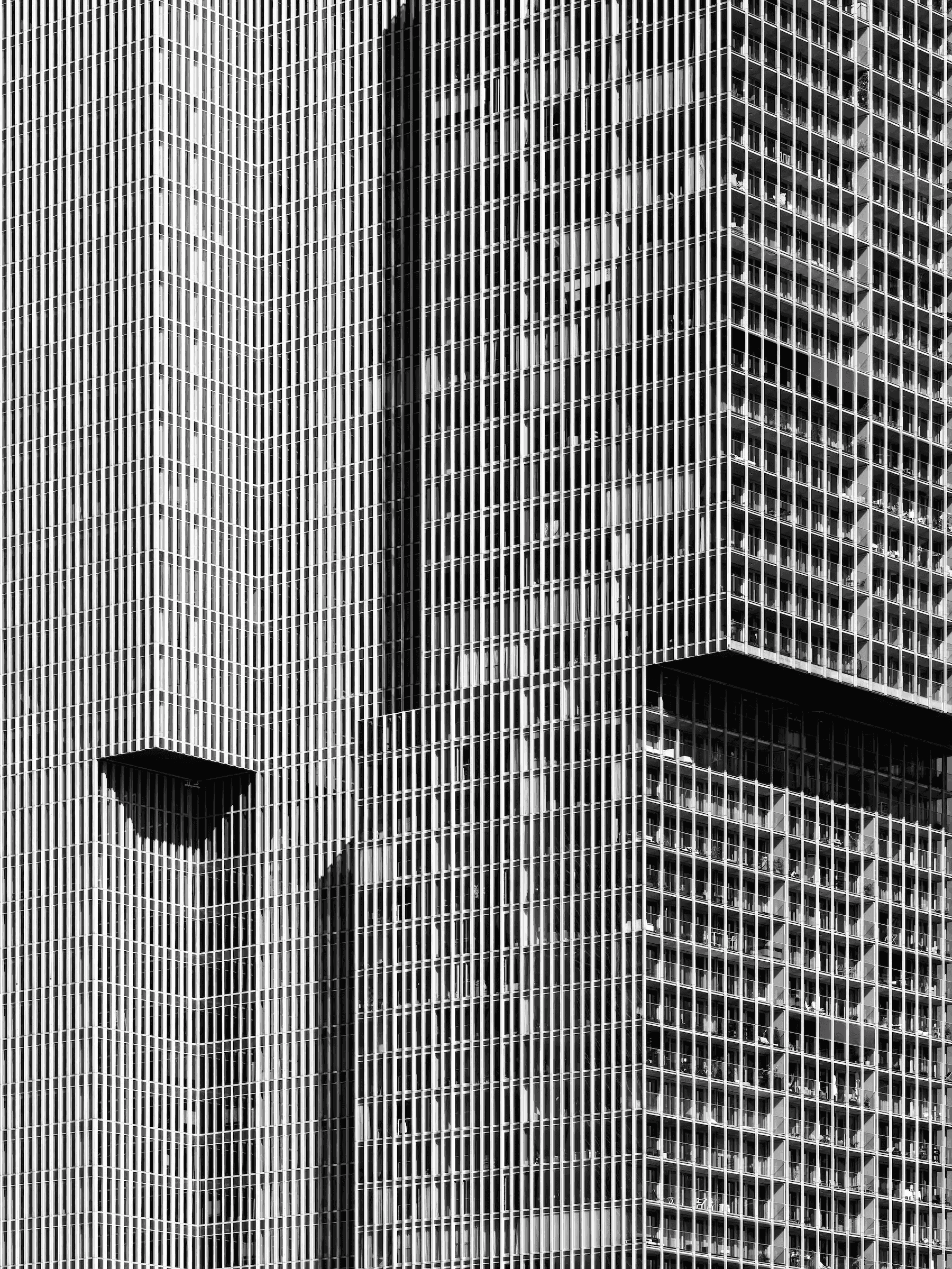 Vertical City: Rhythms of De Rotterdam Abstract black and white photograph of the facade of the 'De Rotterdam' building.