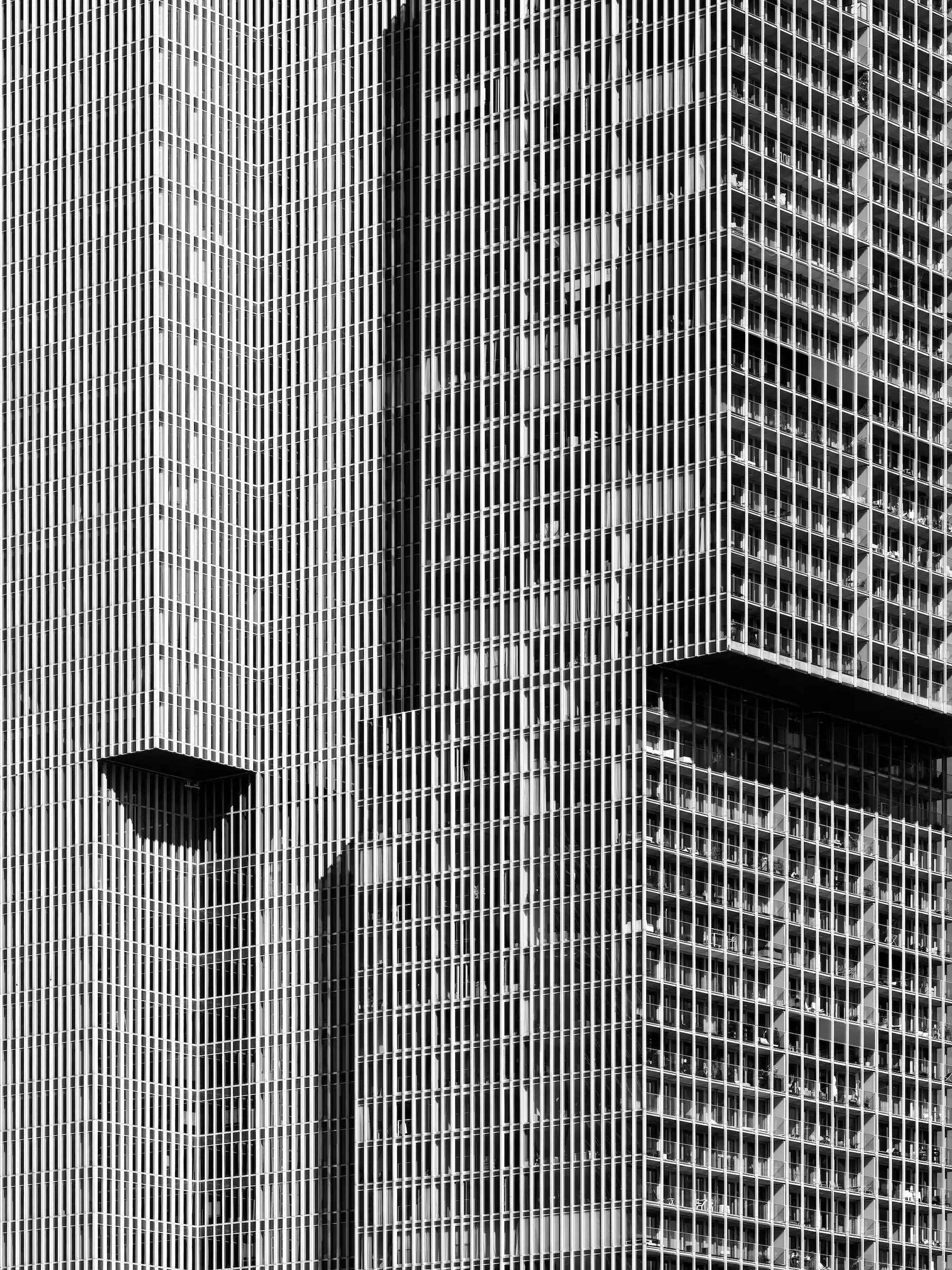 Vertical City: Rhythms of De Rotterdam Black-and-white abstract of the facade of the De Rotterdam building in Rotterdam.