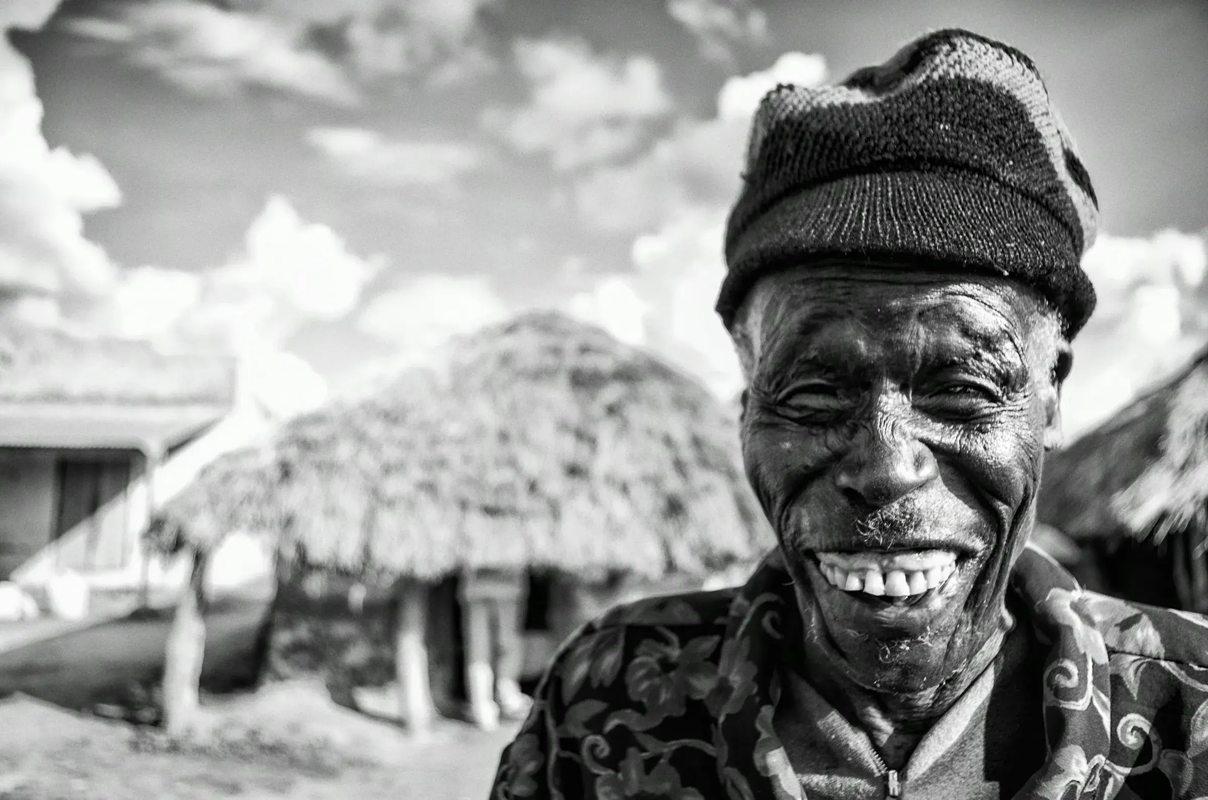 Radiant Smile: Village Elder Portrait Black-and-white portrait of an older man smiling in Amuria, Uganda.