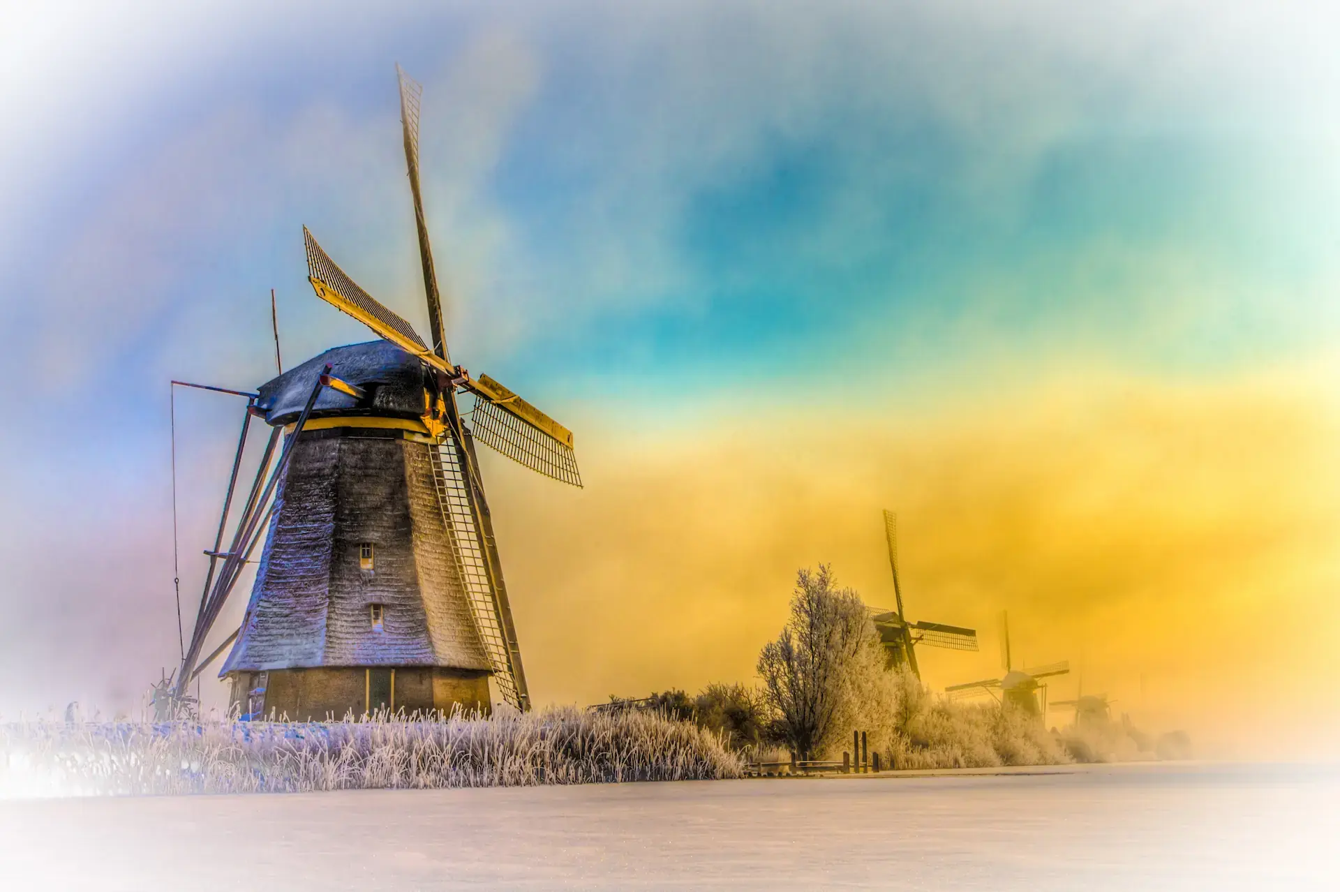 Kinderdijk Windmills in Winter Light Kinderdijk windmills under pastel winter light above frost-covered Dutch fields.