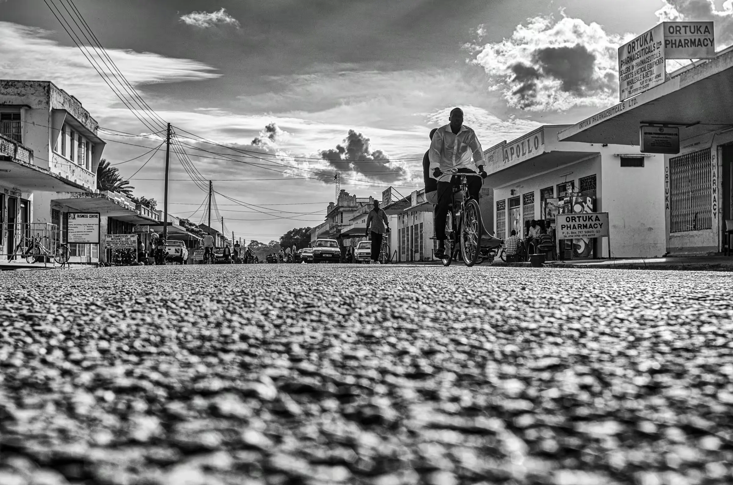 Daily Life in Northern Uganda Black and white street scene photograph in Ortuka, Northern Uganda.