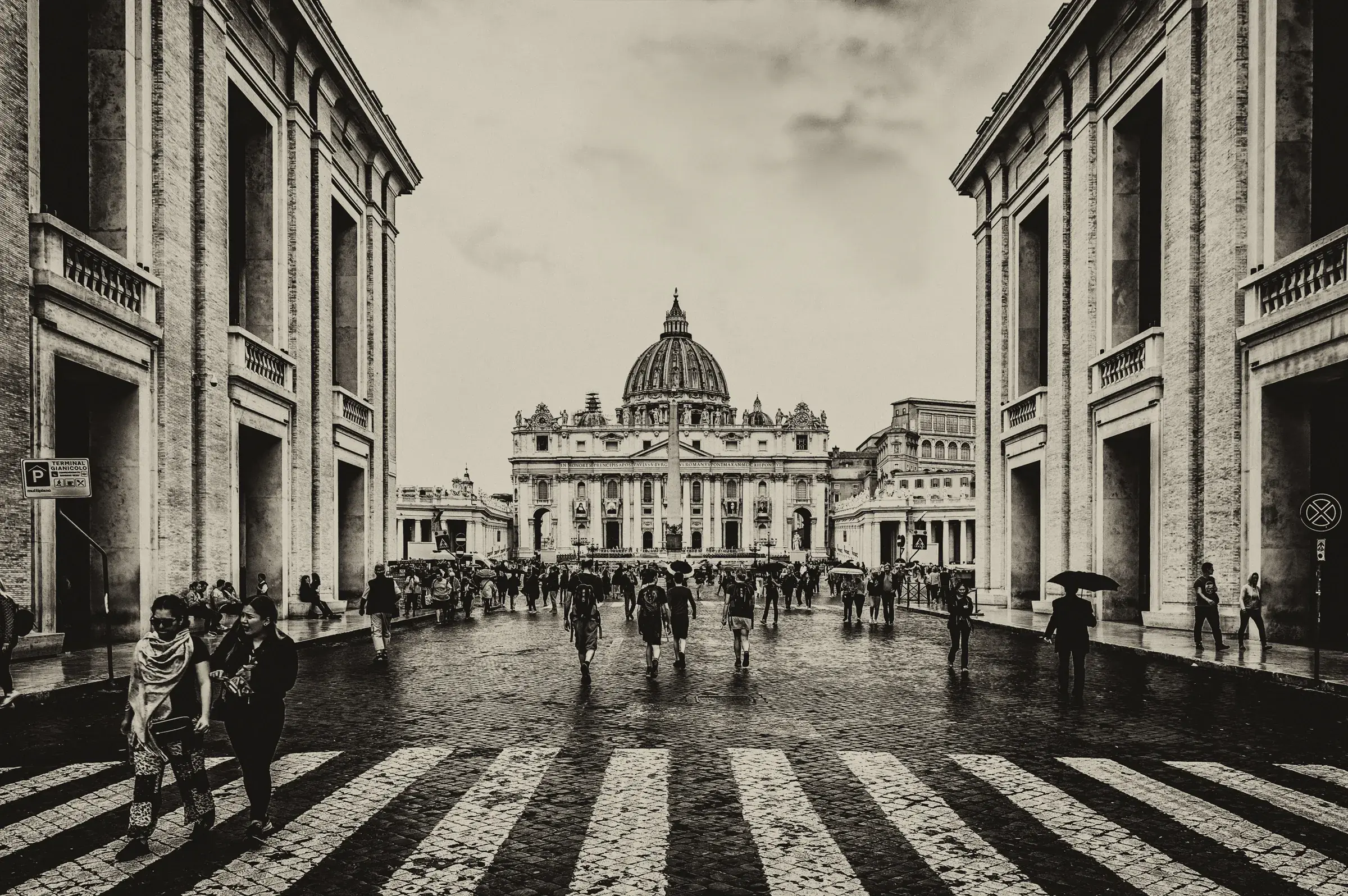 Approach to St. Peter's Basilica Black-and-white view down the Via della Conciliazione toward St. Peter's Basilica.