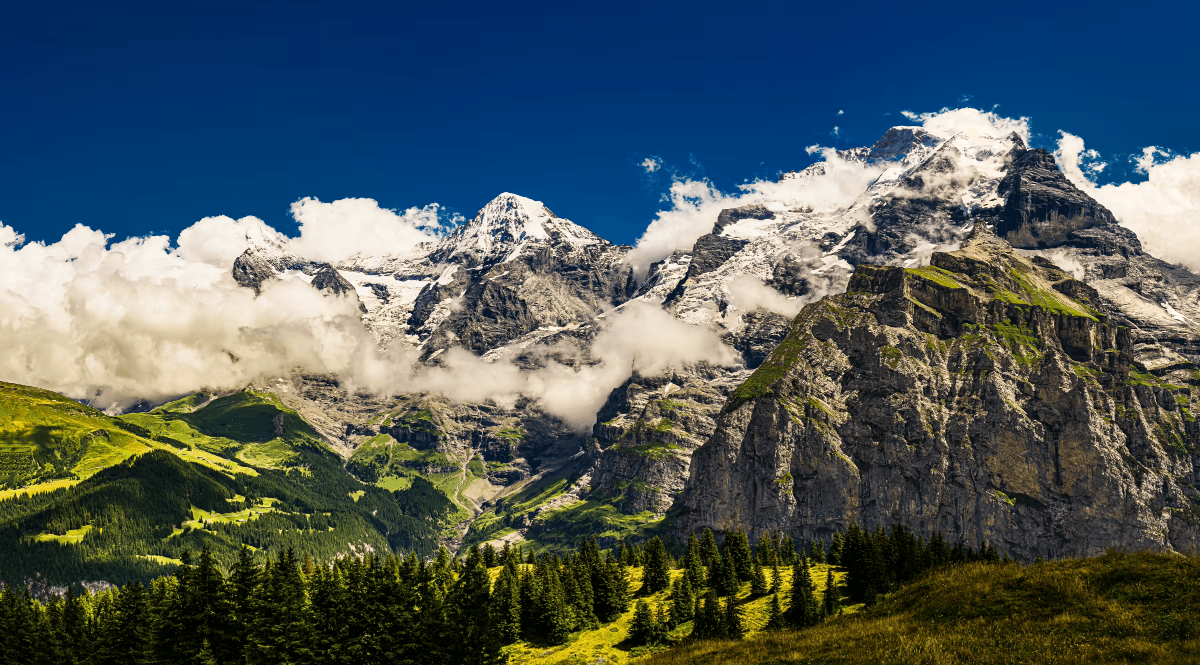 Alpine Majesty: Eiger, Mönch, and Jungfrau Eiger, Mönch, and Jungfrau mountains in the Swiss Alps.