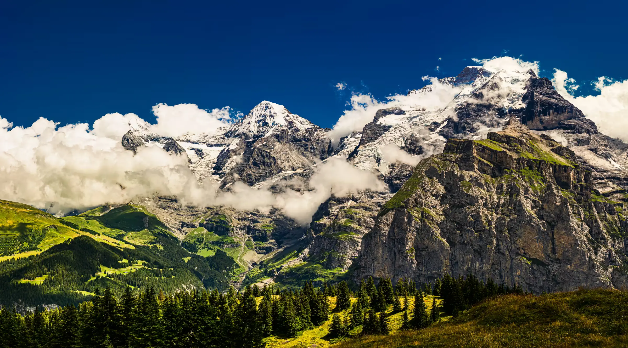 Alpine Majesty: Eiger, Mönch, and Jungfrau Eiger, Mönch, and Jungfrau mountains in the Swiss Alps.